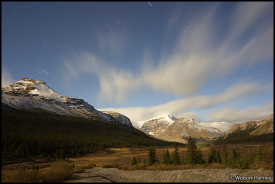 - Streaked clouds and peaks illuminated by moonlight, Jasper NP, Canada -