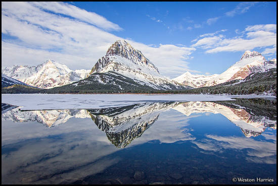 - Swiftcurrent Lake Reflecting Mt. Gould, Grinnell Pt, Swiftcurrent Mtn, and Mt. Wilbur, Glacier NP -