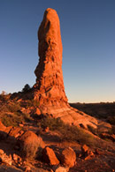 - A Sandstone Tower Formation in the Windows Area at Sunset, Arches NP -