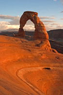 - Delicate Arch at Sunset, with Storm Clouds Over the La Sal Mtns, Arches NP -