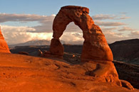 - Delicate Arch at Sunset, with Storm Clouds Over the La Sal Mtns, Arches NP -