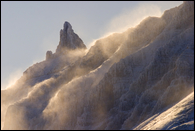 - Sunrise Light Illuminating Snow Blowing off of Crags in the Many Glacier Area, Glacier NP -