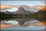 - Painted Teepee Peak, Mt. Sinopah, and Mt. Helen Reflected
in Pray Lake at Sunrise, Glacier NP -