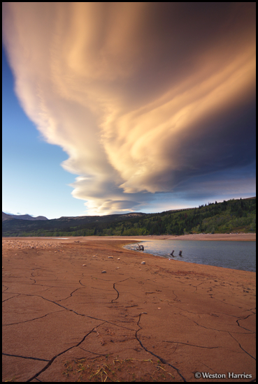 - Unusual Lenticular Cloud Formations Above the
Cracked Shoreline of Lower Two Medicine Lake
at Sunset, Glacier NP -