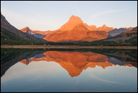 - Swiftcurrent Mtn and Mt. Wilbur
Reflected in Swiftcurrent Lake, Sunrise, Glacier NP -