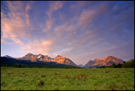 - Sunrise Light on the Peaks Over a Meadow in the Belly River Area, Glacier NP -