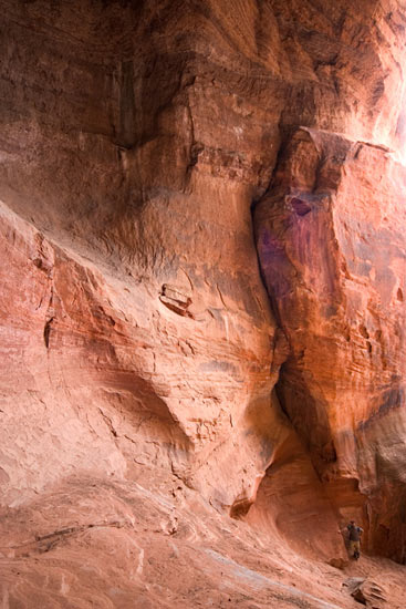 - Hiker Inside a Cave in Cave Knoll, Lower Kolob Plateau, Zion NP -